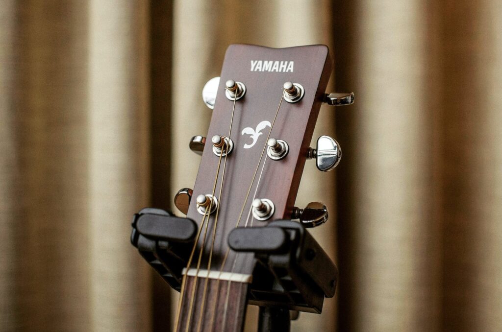 close up photography of a yamaha acoustic guitar